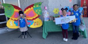 Girl Scouts gain entrepreneurial skills at a Cookie Booth.