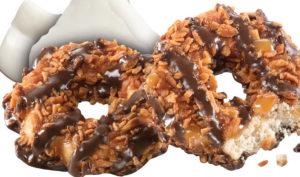 Samoas® | Crisp cookies, coated in caramel, sprinkled with toasted coconut, and striped with dark chocolaty coating
